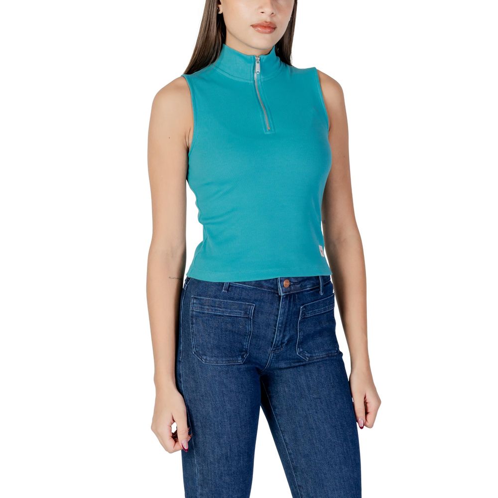 Woman wearing blue top and jeans
