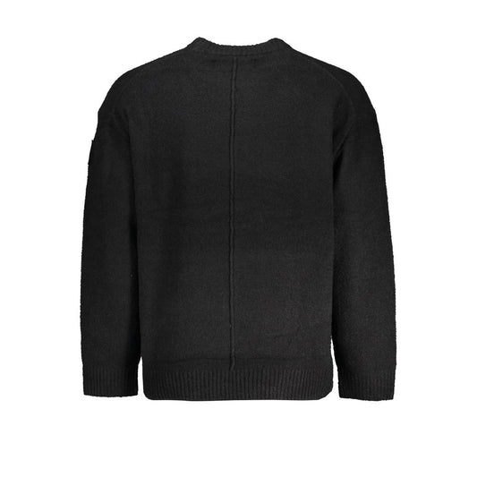 Dark colored sweater on hanger