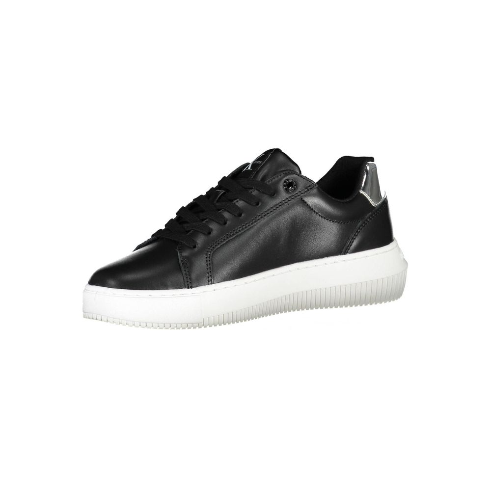 Black leather women's sneaker with white sole, featuring a round toe and lace-up front