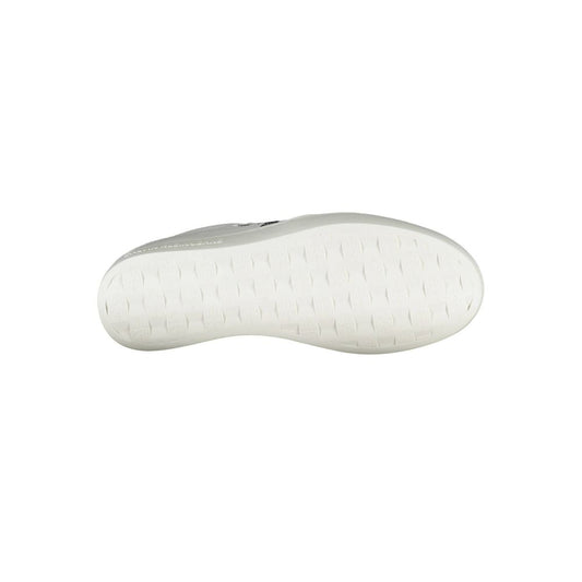 A white leather women's sneaker with a low top design, featuring a round toe and a flat sole