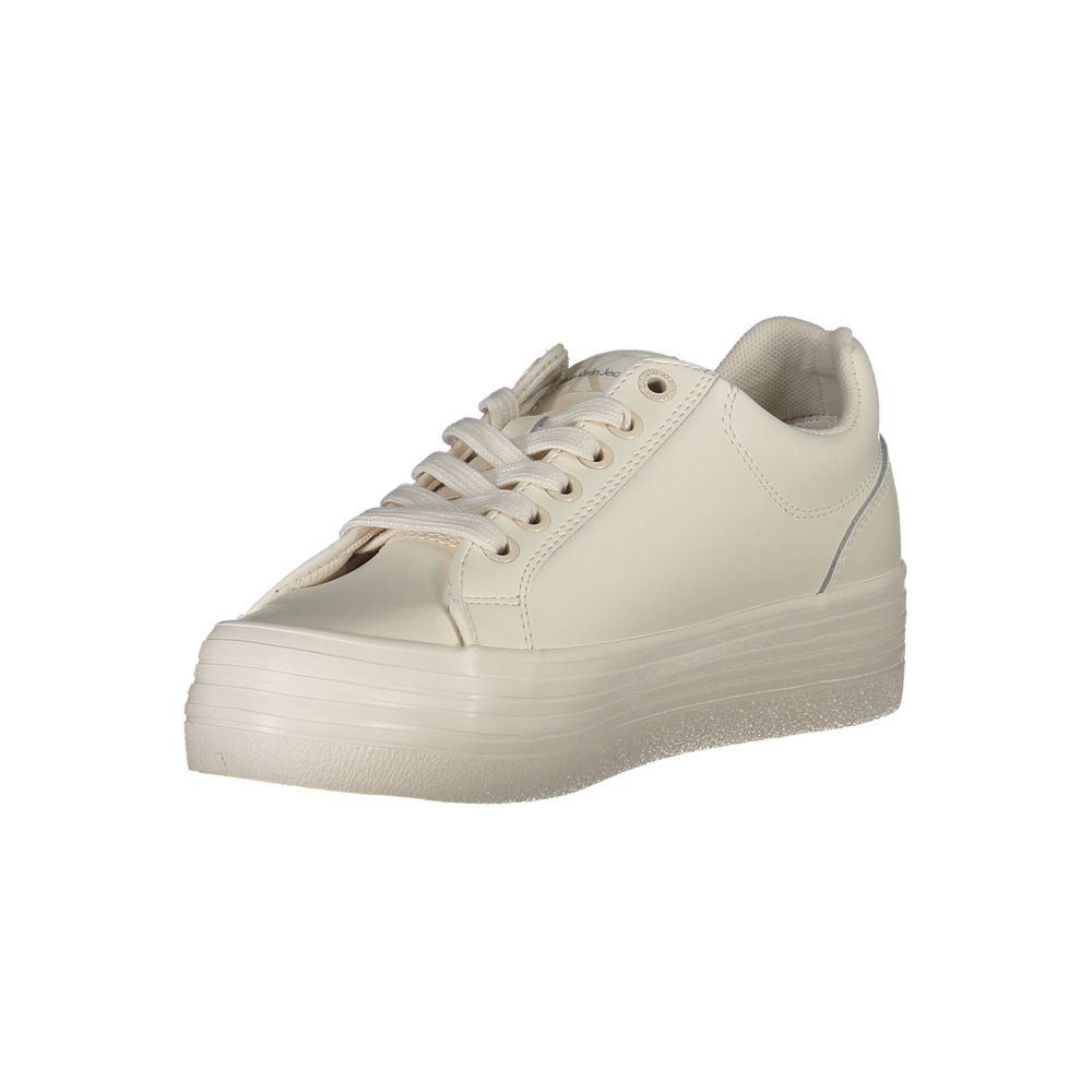 A white leather women's sneaker with a lace-up front, featuring a low top and a flat sole