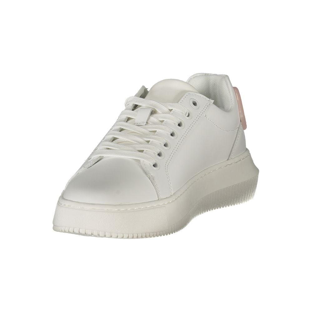 A white women's sneaker with a low top, laces, and a flat sole