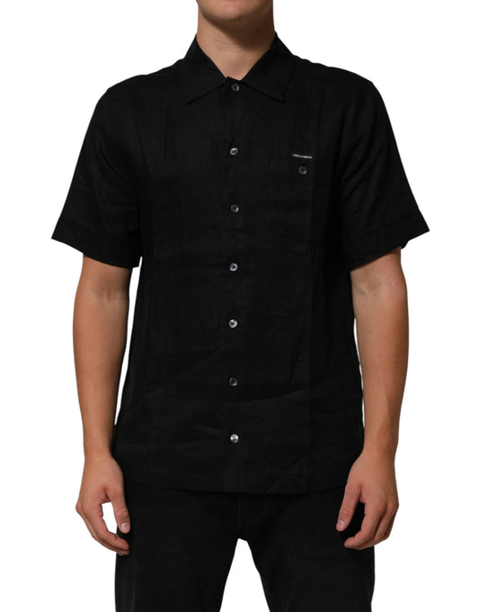 Man wearing black shirt with buttons down front