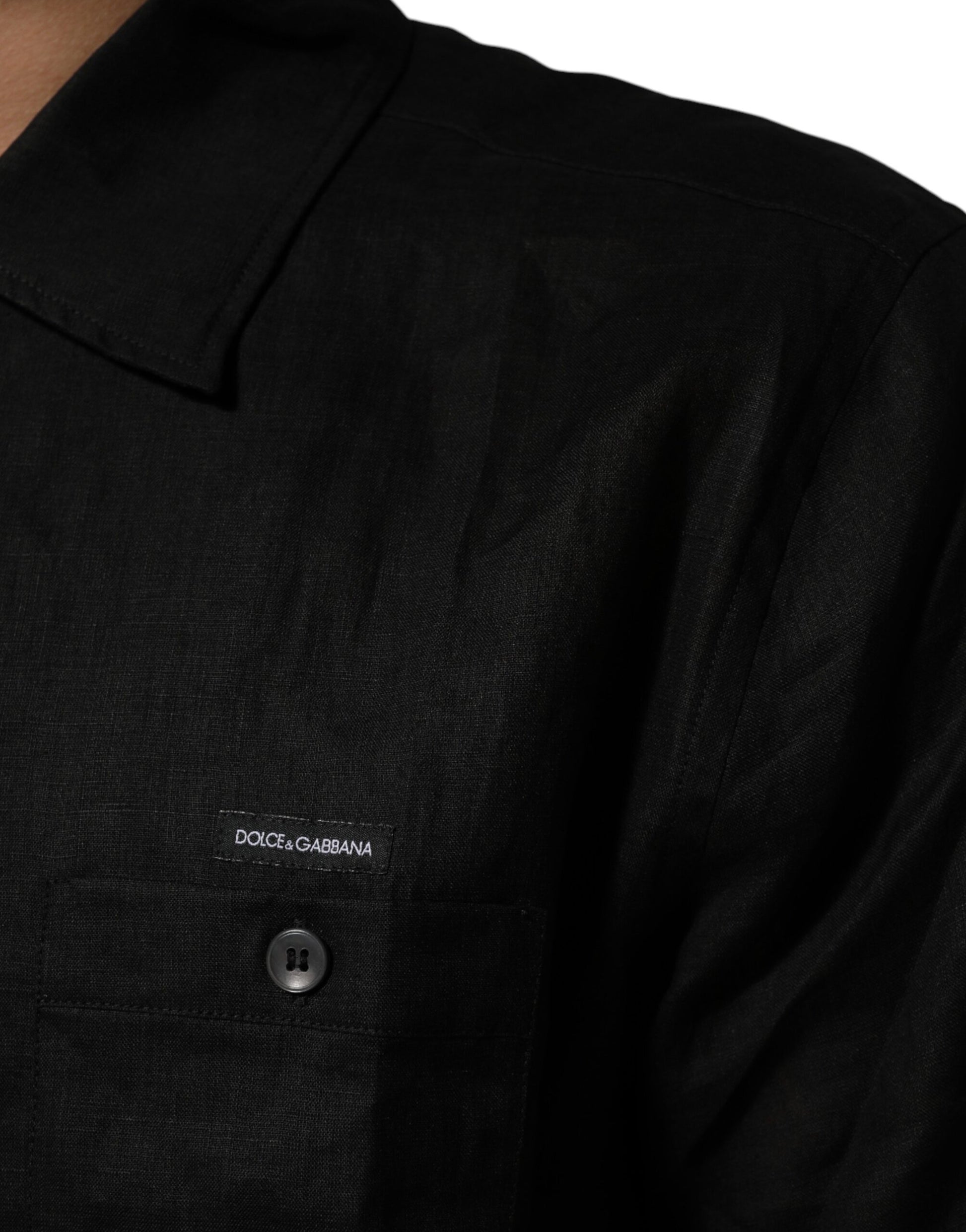 Black shirt with a logo on the left chest area