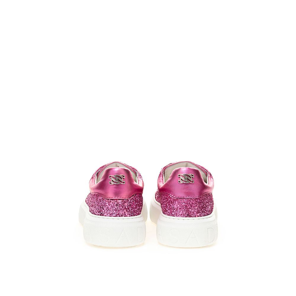 Pair of pink sneakers with glittery texture on soles