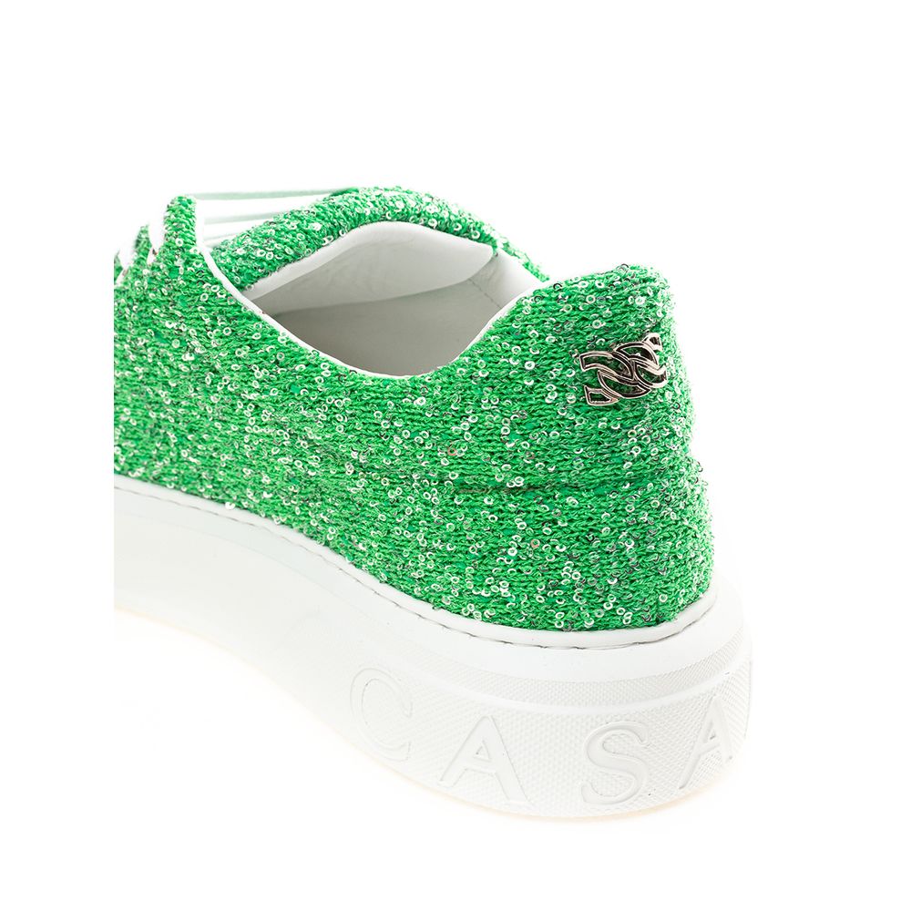 Green glittery sneakers with white soles and a logo on the side
