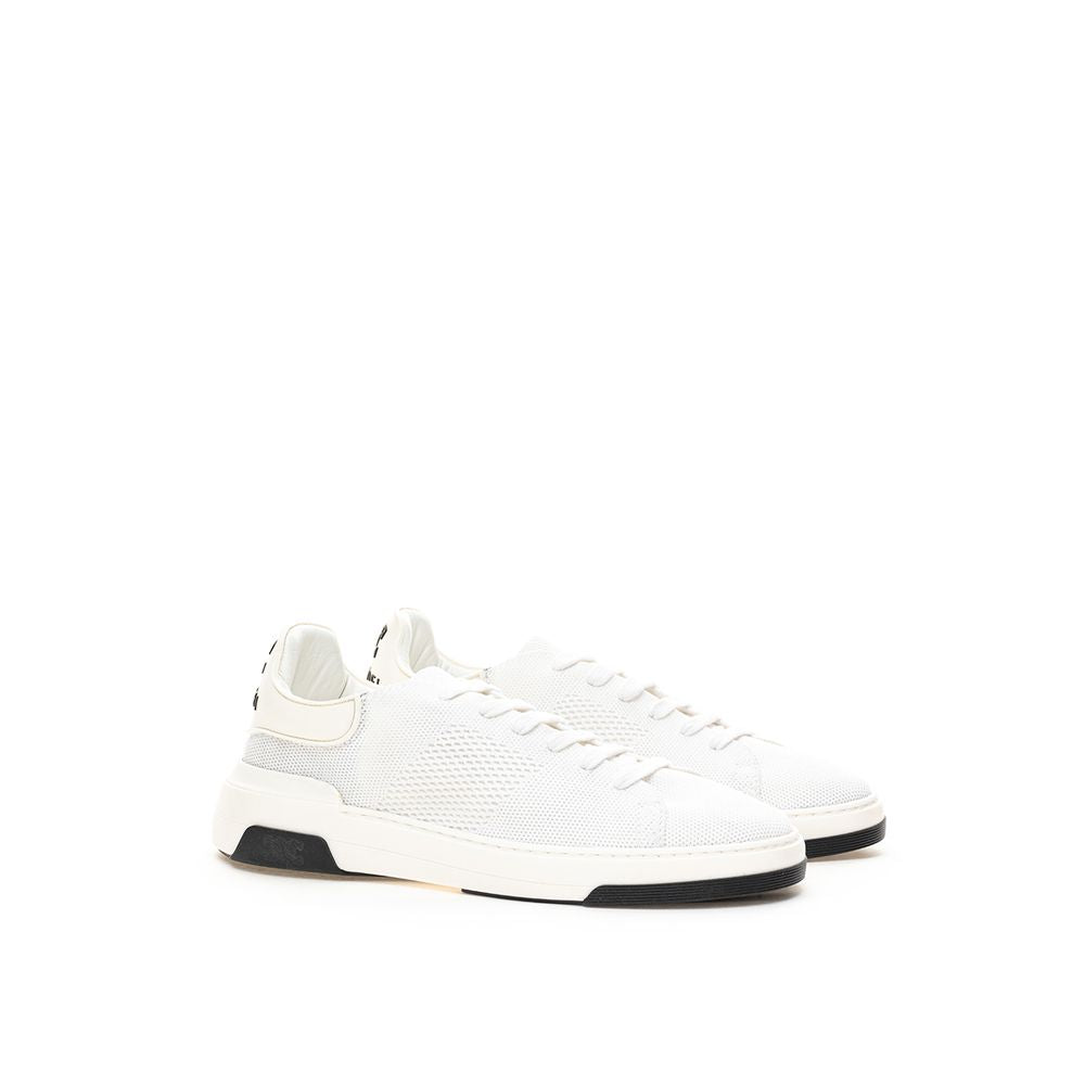 White sneakers with black laces and soles