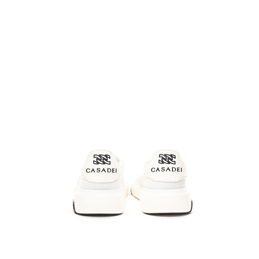 Pair of white sneakers with black laces and a logo on the side