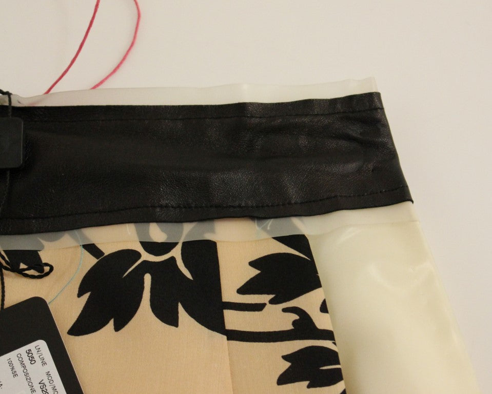 Black leather belt on a white surface