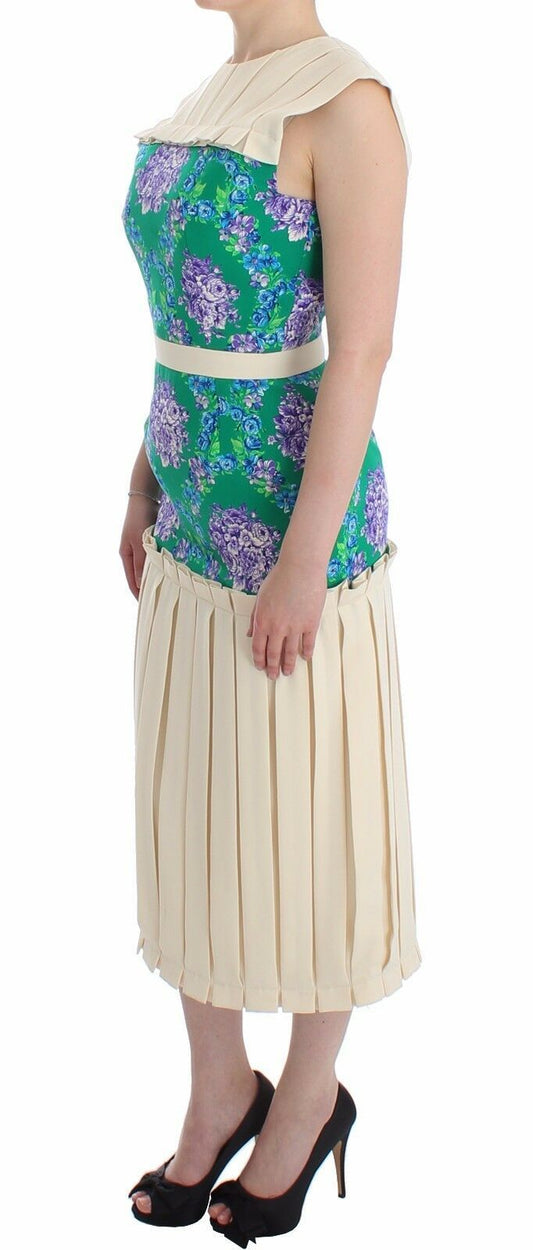A woman wearing a multicolored dress with floral pattern and sleeveless design
