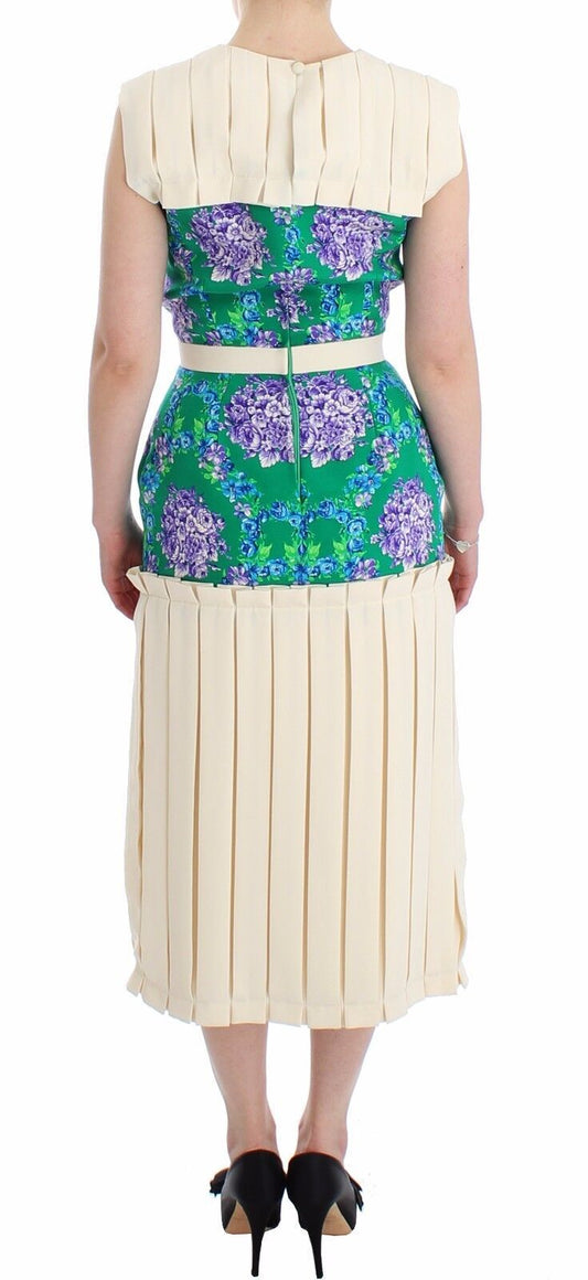 A sleeveless dress with a floral pattern and a belt at the waist
