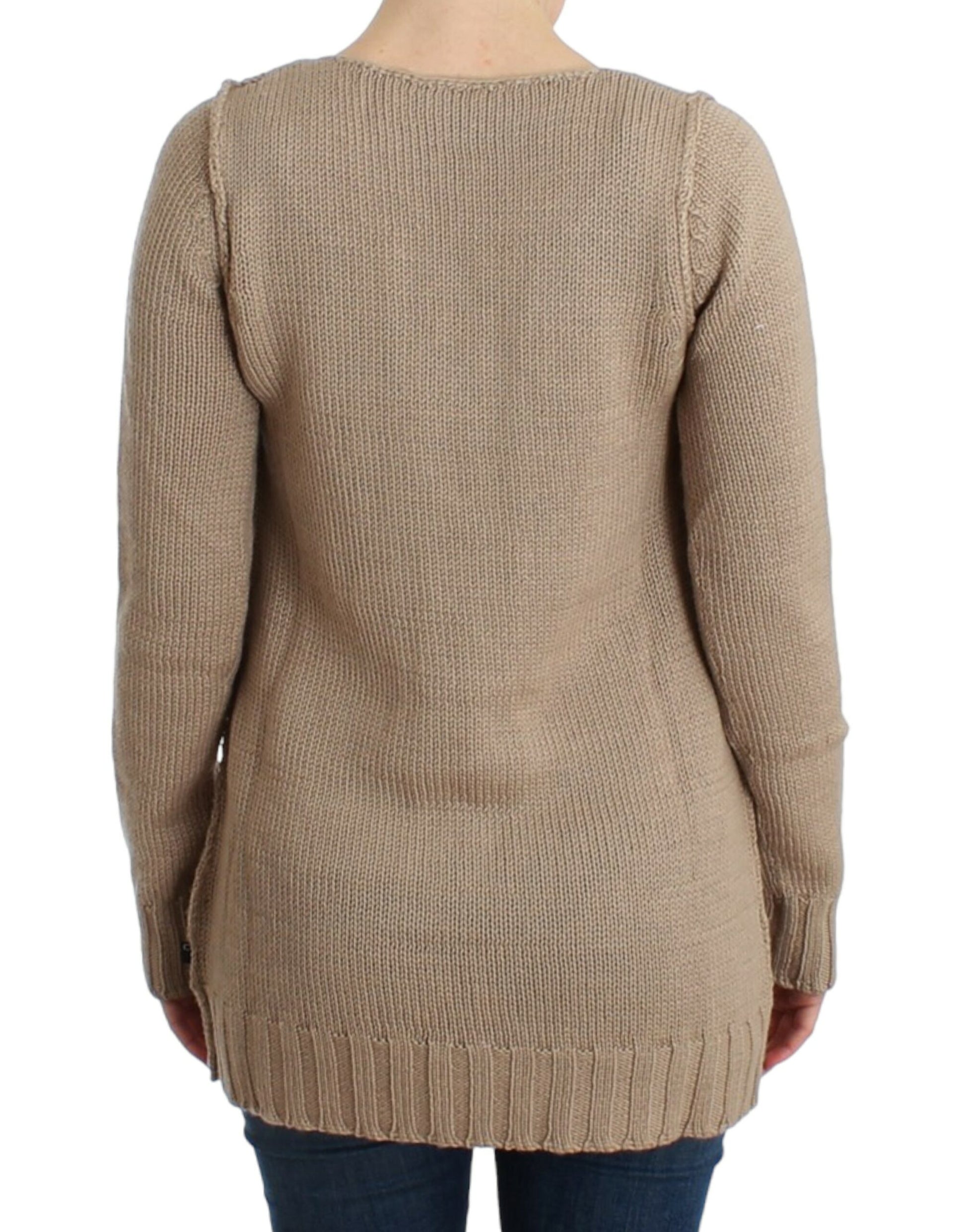 Tan knit sweater with fringe details on back