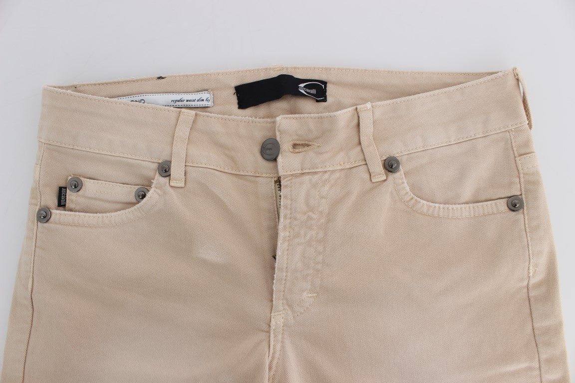 Tan shorts with two pockets and a button closure