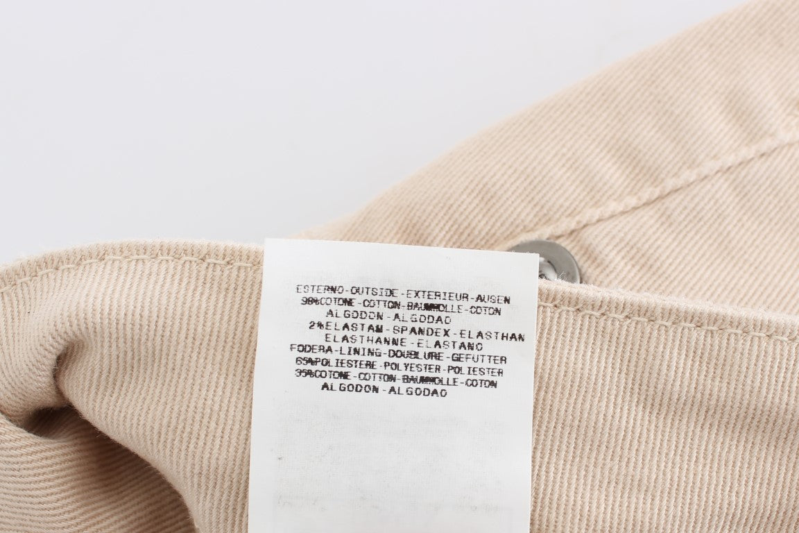 Tan garment with tag visible on inside of collar