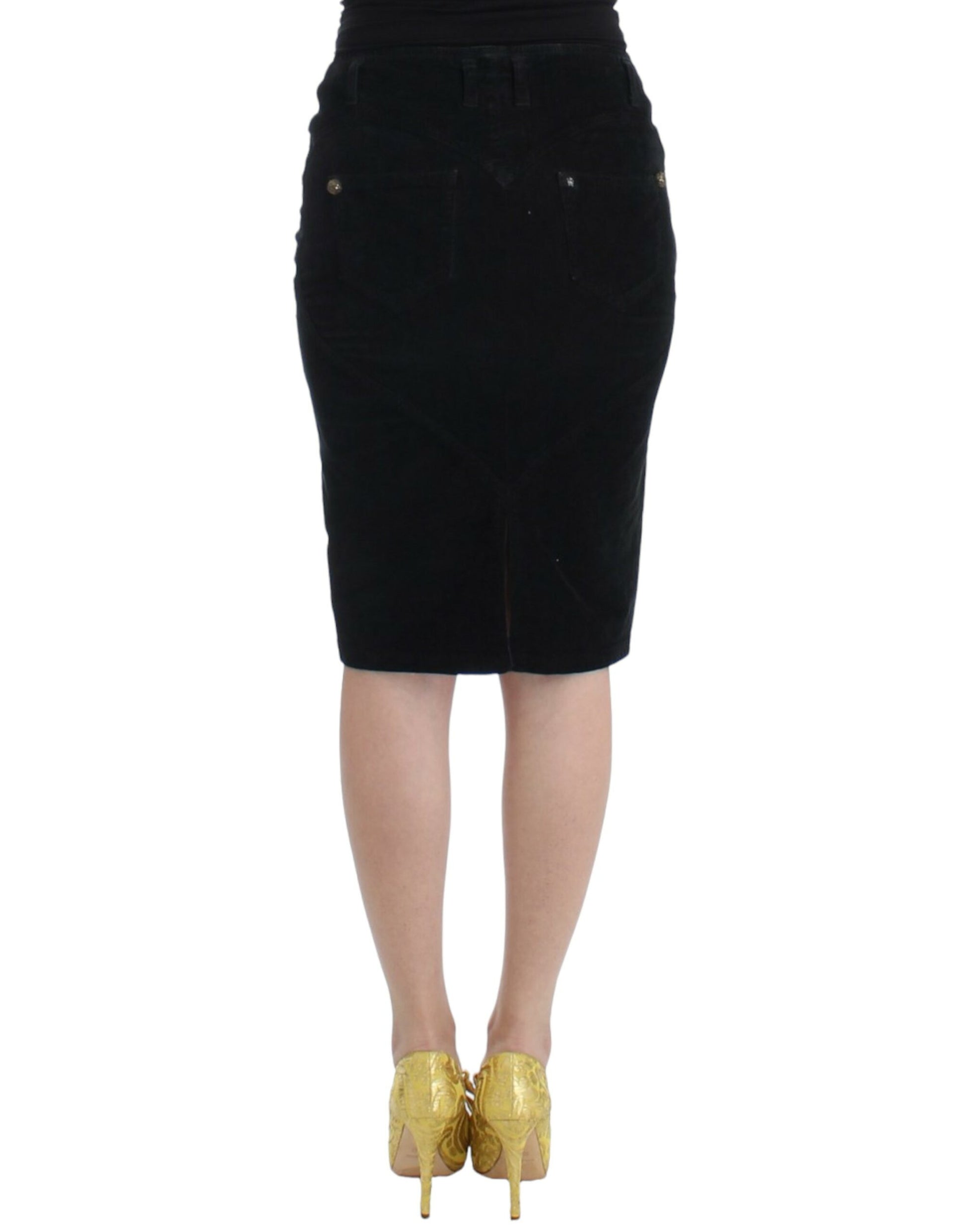 Black skirt worn by a woman with yellow shoes
