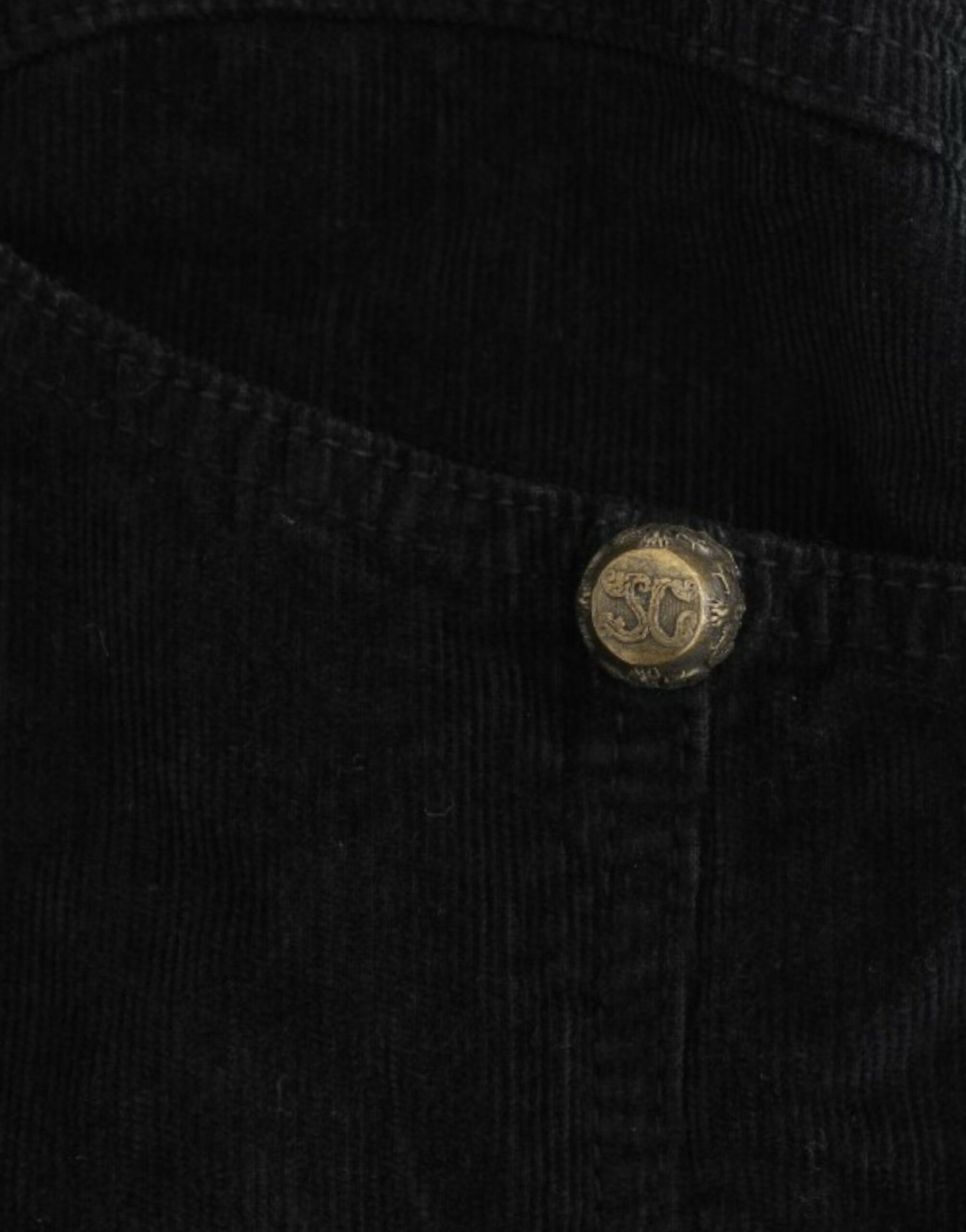 Button on black fabric