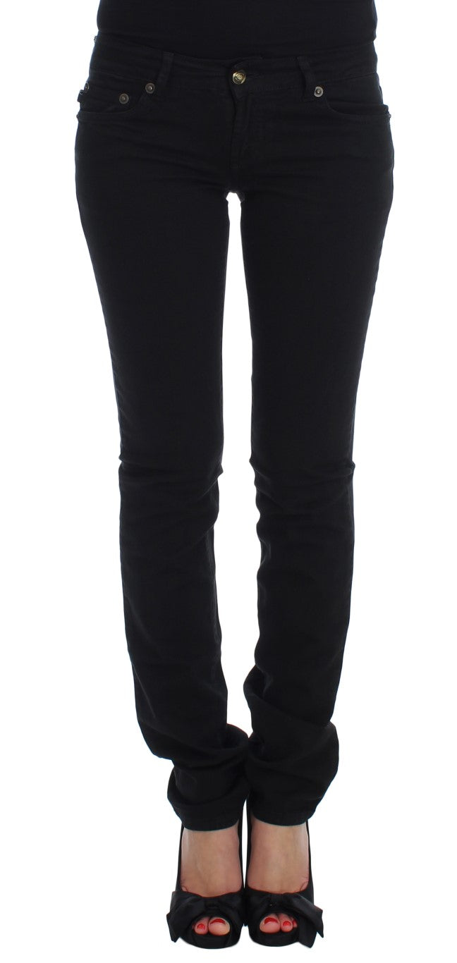 Pair of black skinny jeans with zipper detailing and high waist