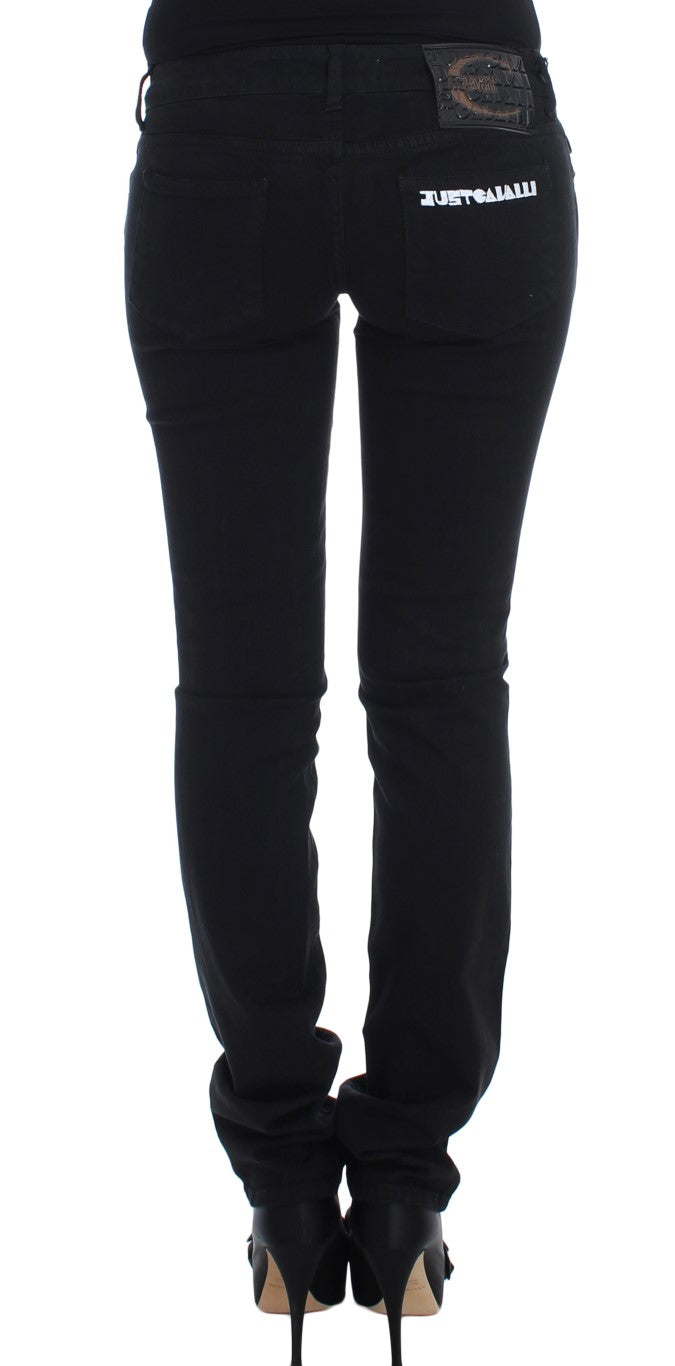 Pair of black skinny jeans with a visible waistband and belt loops