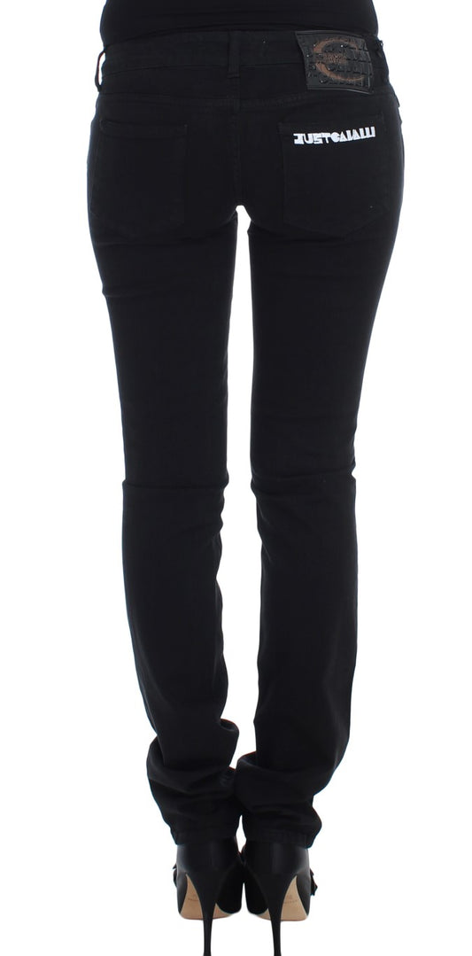 Pair of black skinny jeans with a visible waistband and belt loops