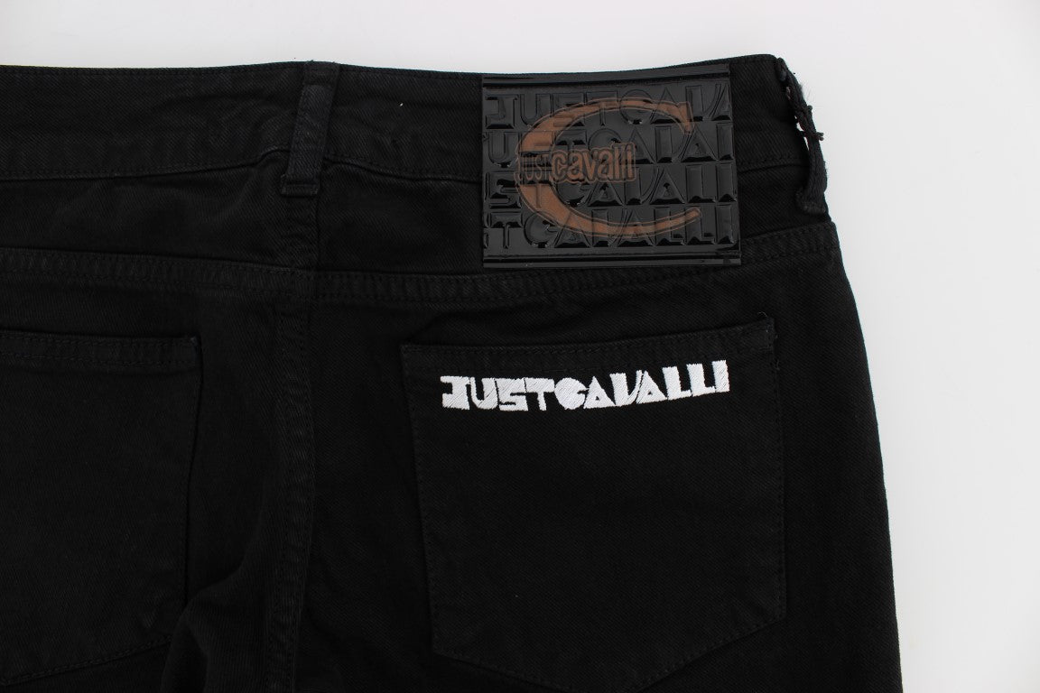 Pair of black cargo pants with visible brand logos and text on them