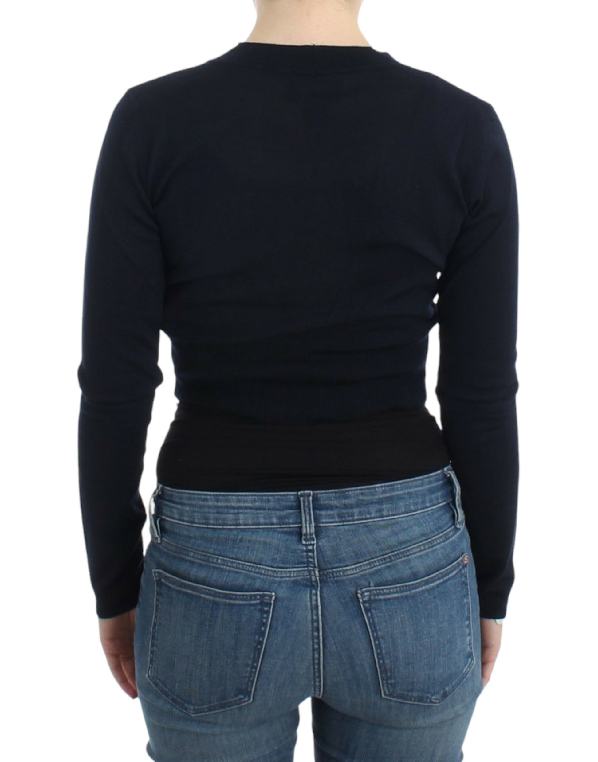 Woman wearing black sweater and blue jeans