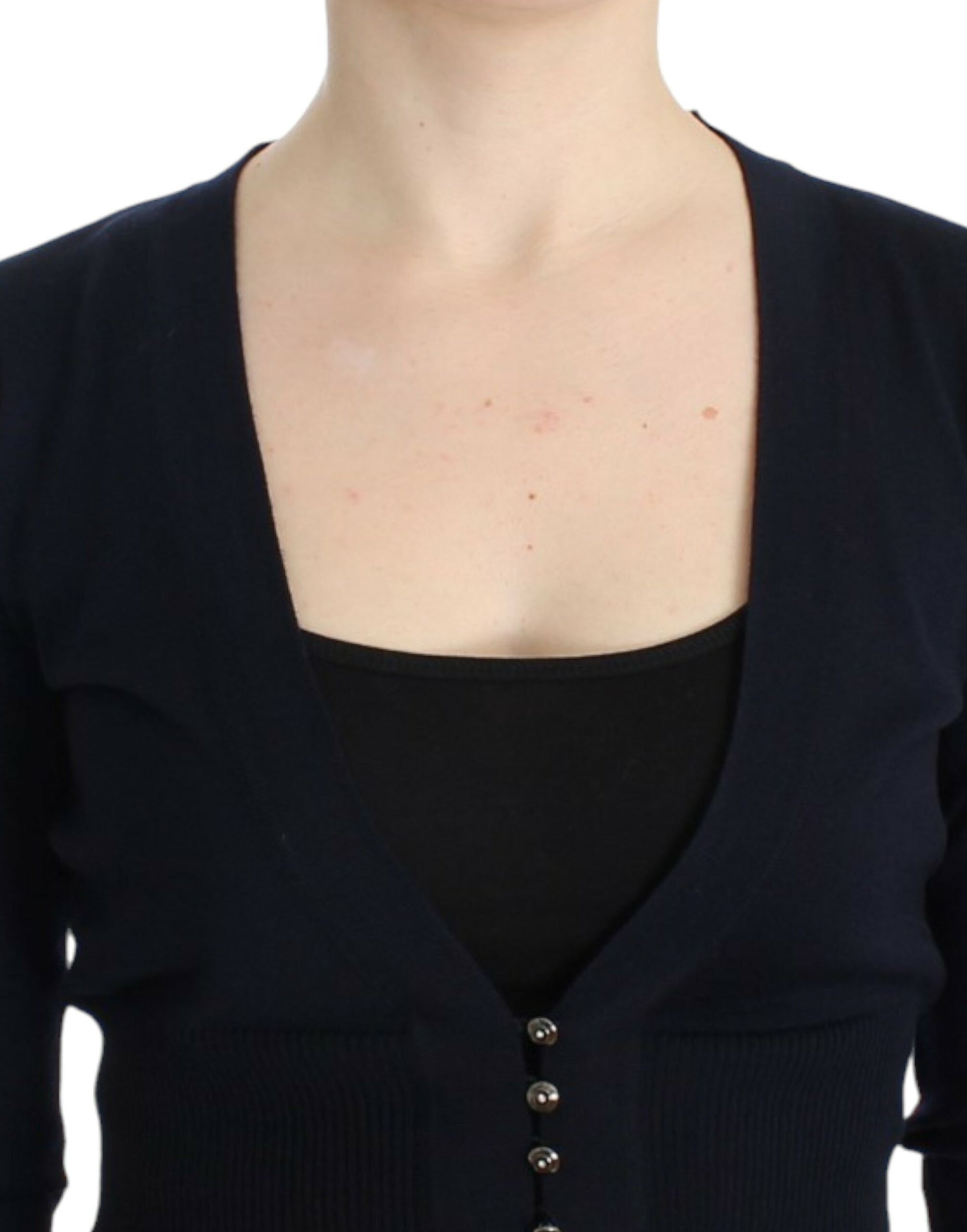 Woman wearing a black cardigan with buttons