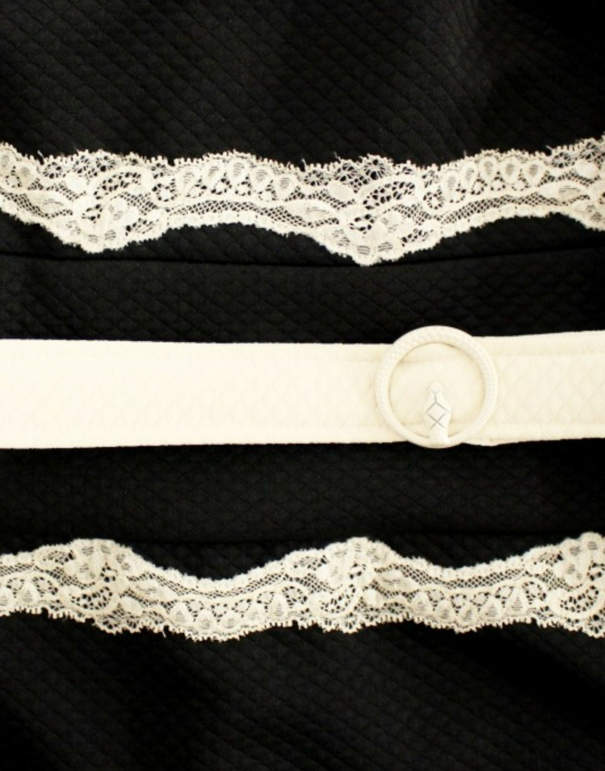 White lace belt on black dress