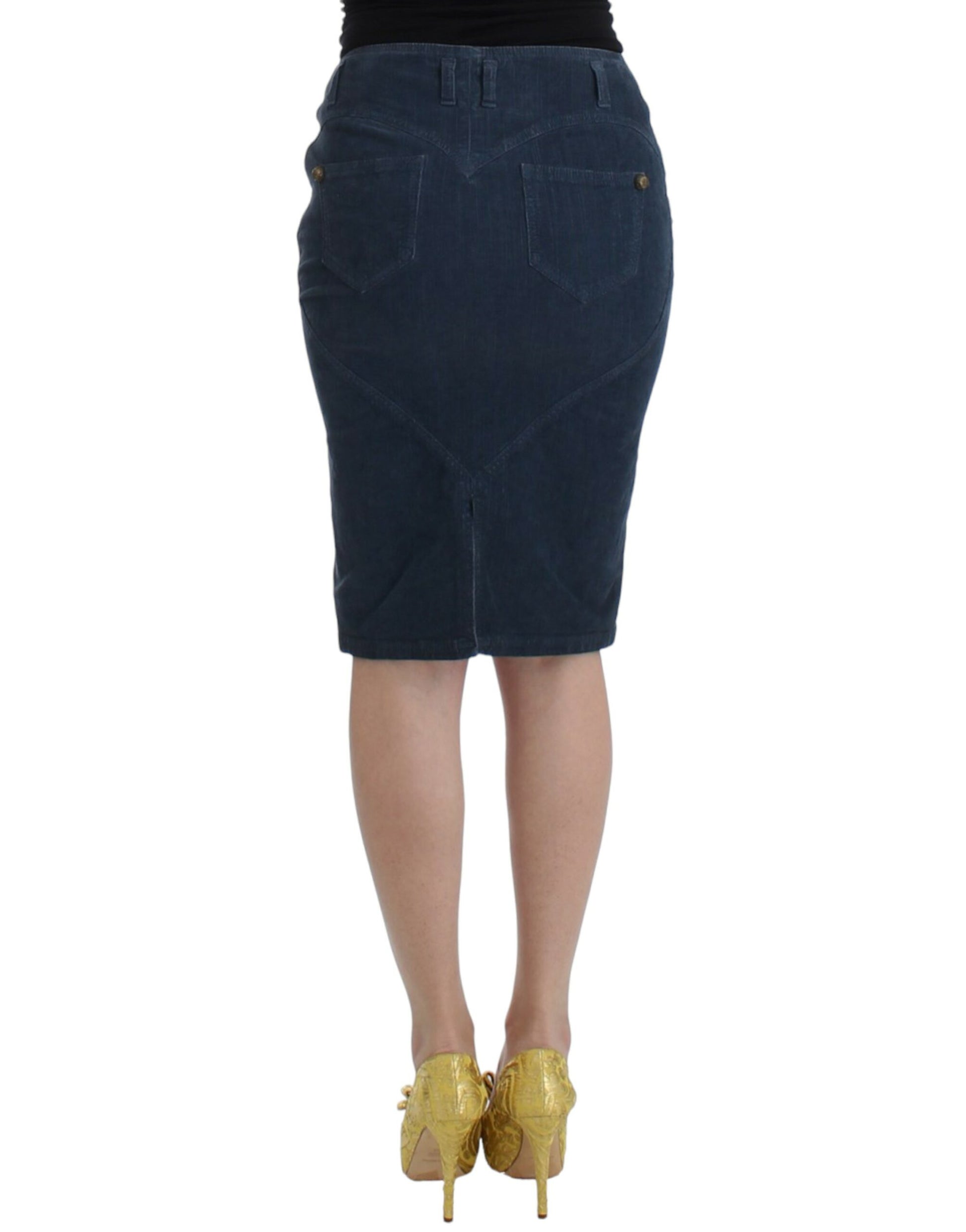 Woman wearing denim skirt and gold heels