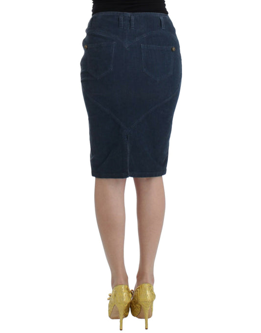 Woman wearing denim skirt and gold heels
