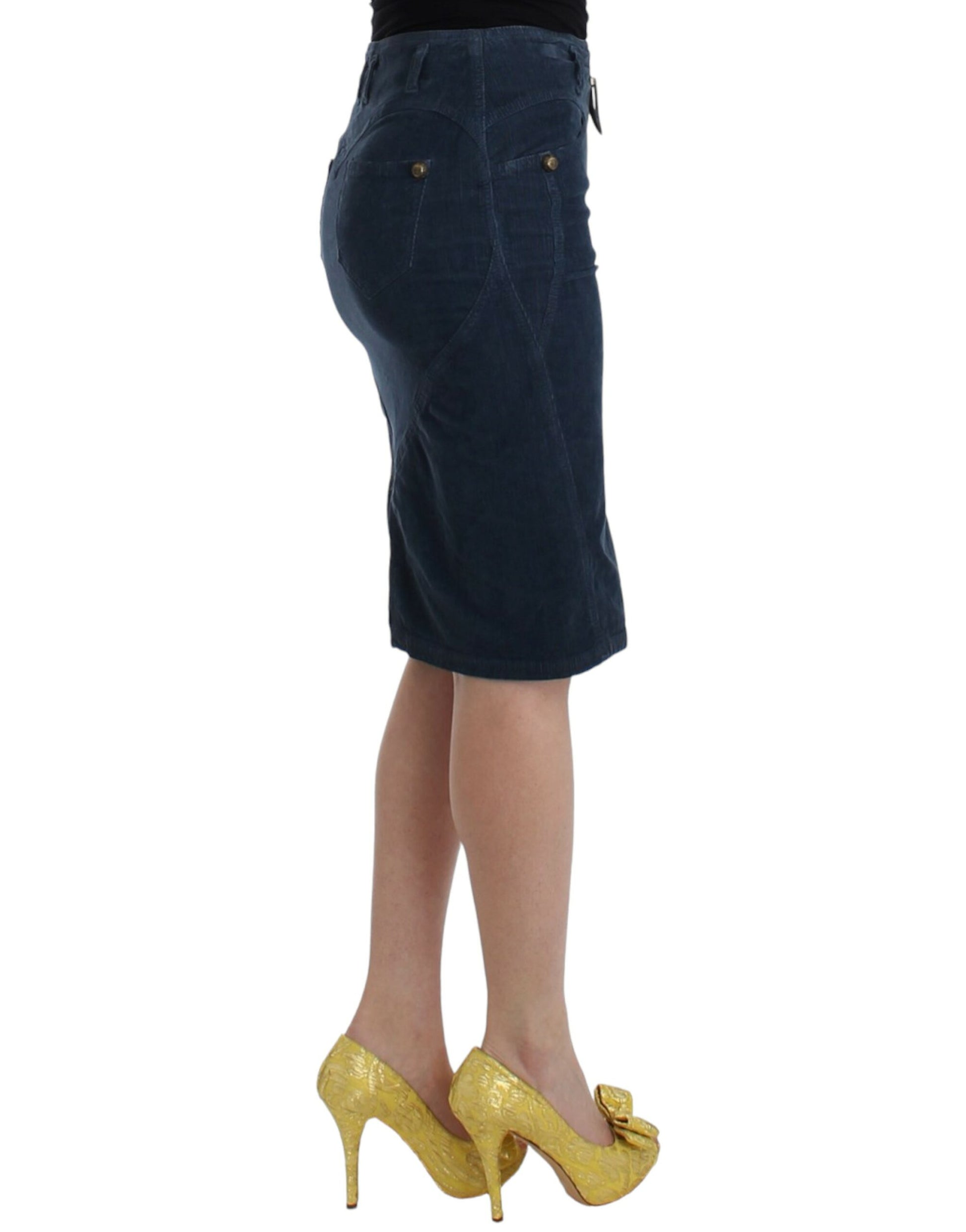Woman wearing denim skirt and gold high heels