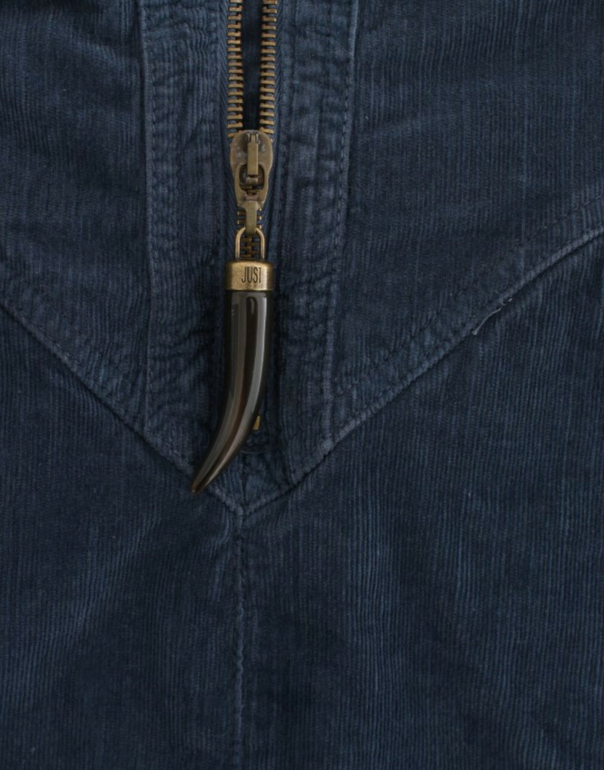 Zipper pull on blue sweater