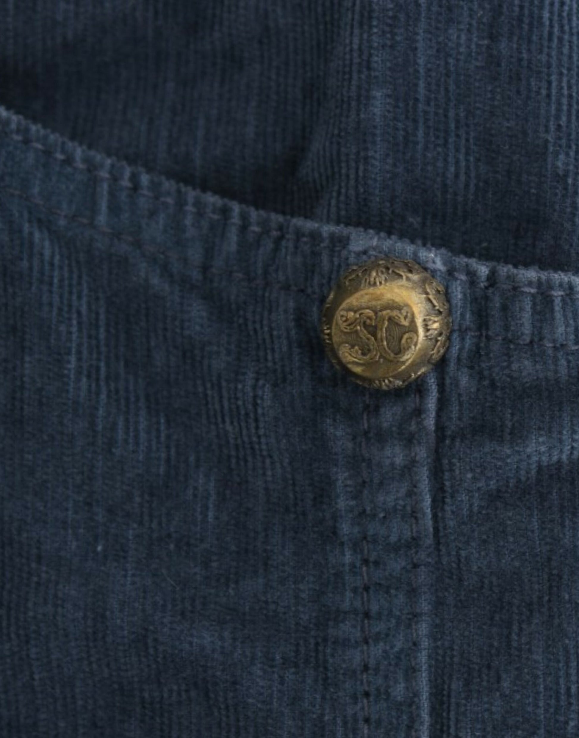 Blue denim jeans with button closure