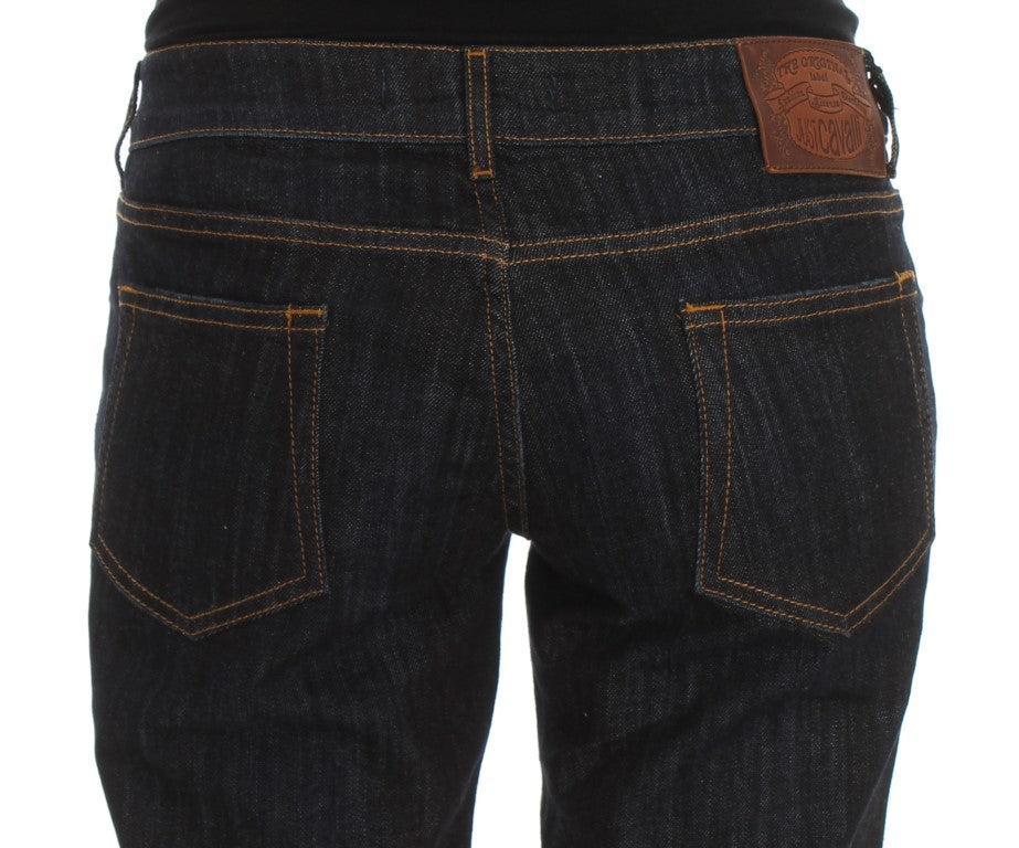 Pair of blue denim jeans with brown stitching and a leather patch on the back right side