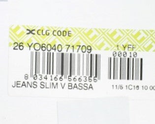 Yellow label on clothing item with barcode and product information