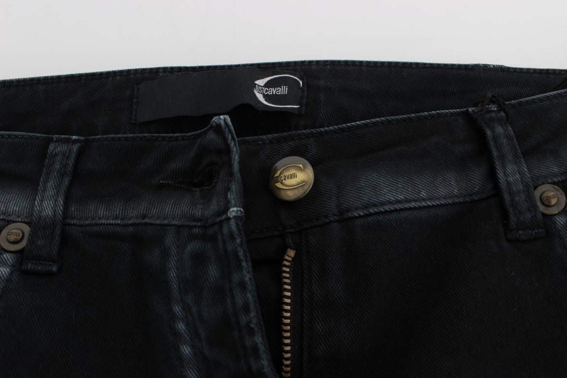 Pair of dark blue jeans with zipper and button closure