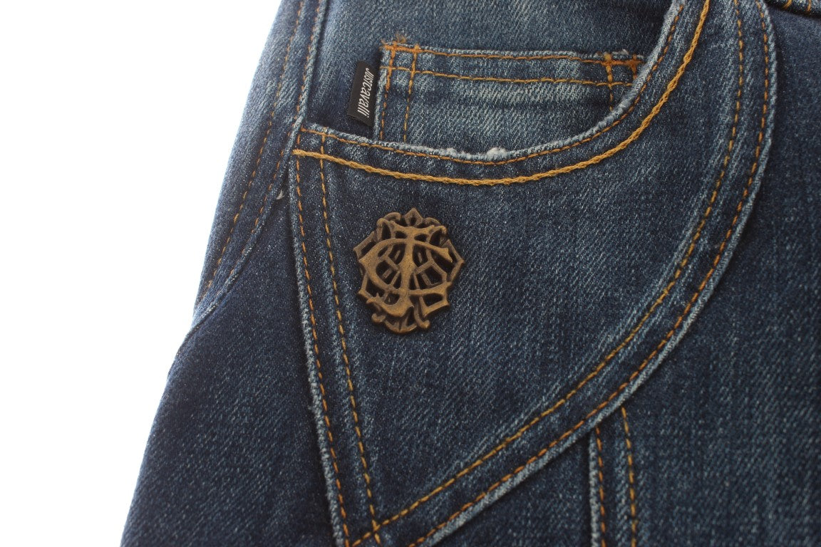 Blue denim jeans with a small embroidered emblem on the back pocket