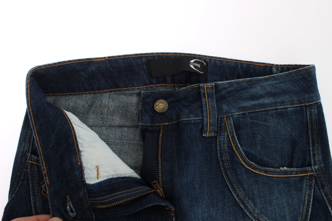 Pair of blue denim jeans with visible stitching and button closure