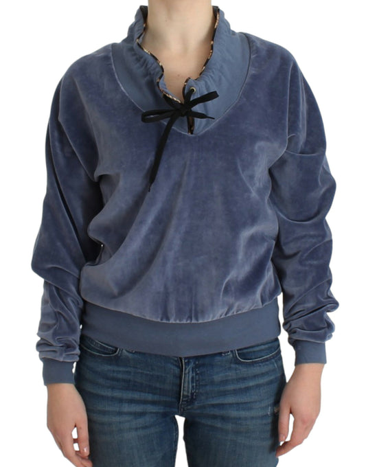 Woman wearing a blue velvet sweater