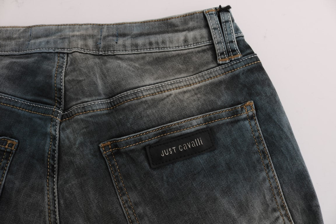 Pair of blue denim jeans with visible stitching and a label on the waistband