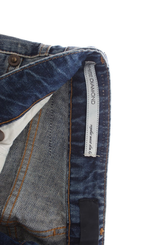 Blue denim jeans with visible stitching and a label on the waistband