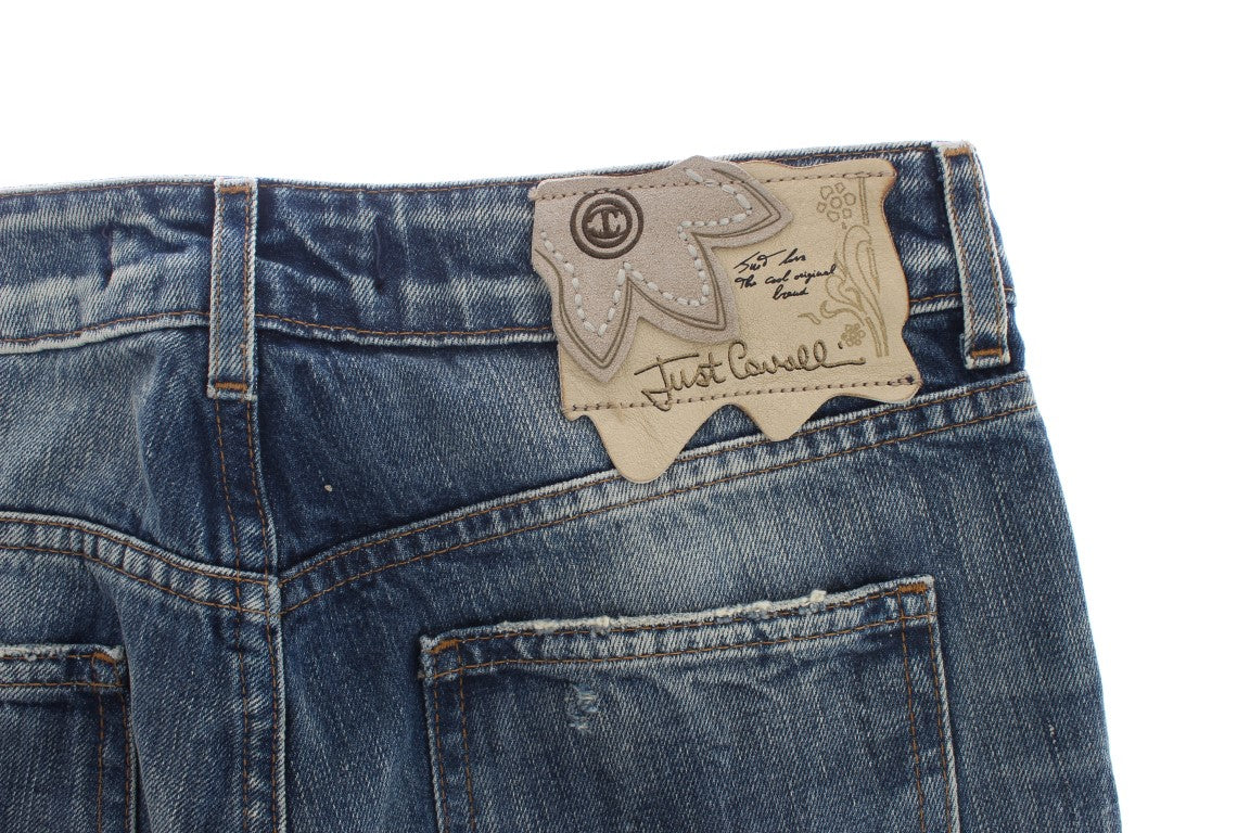 Pair of blue denim jeans with a tag inside the waistband