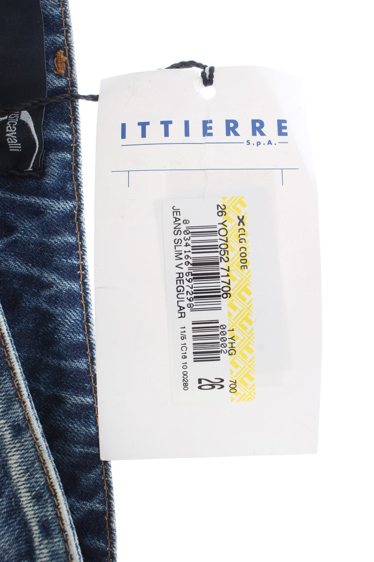 Blue jeans with white tag attached to waistband