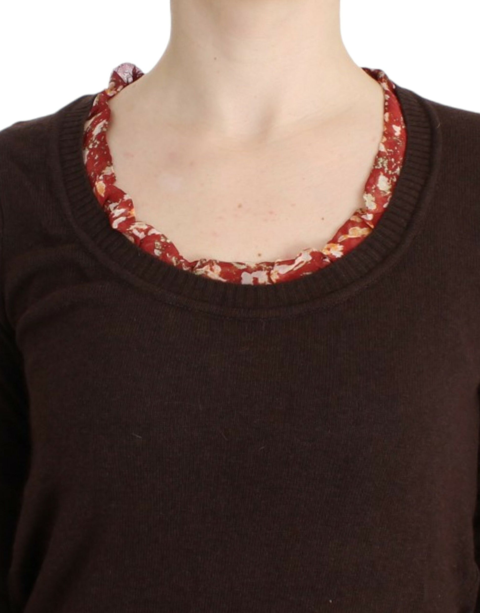 Woman wearing brown sweater with red collar