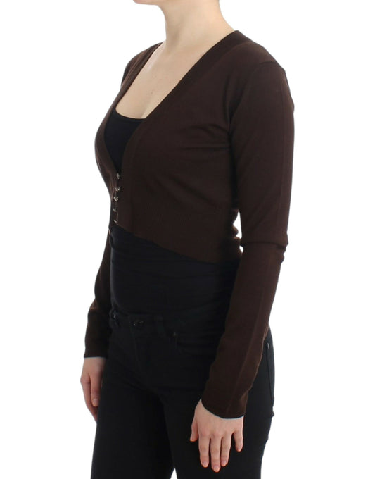 Woman wearing brown sweater and black pants
