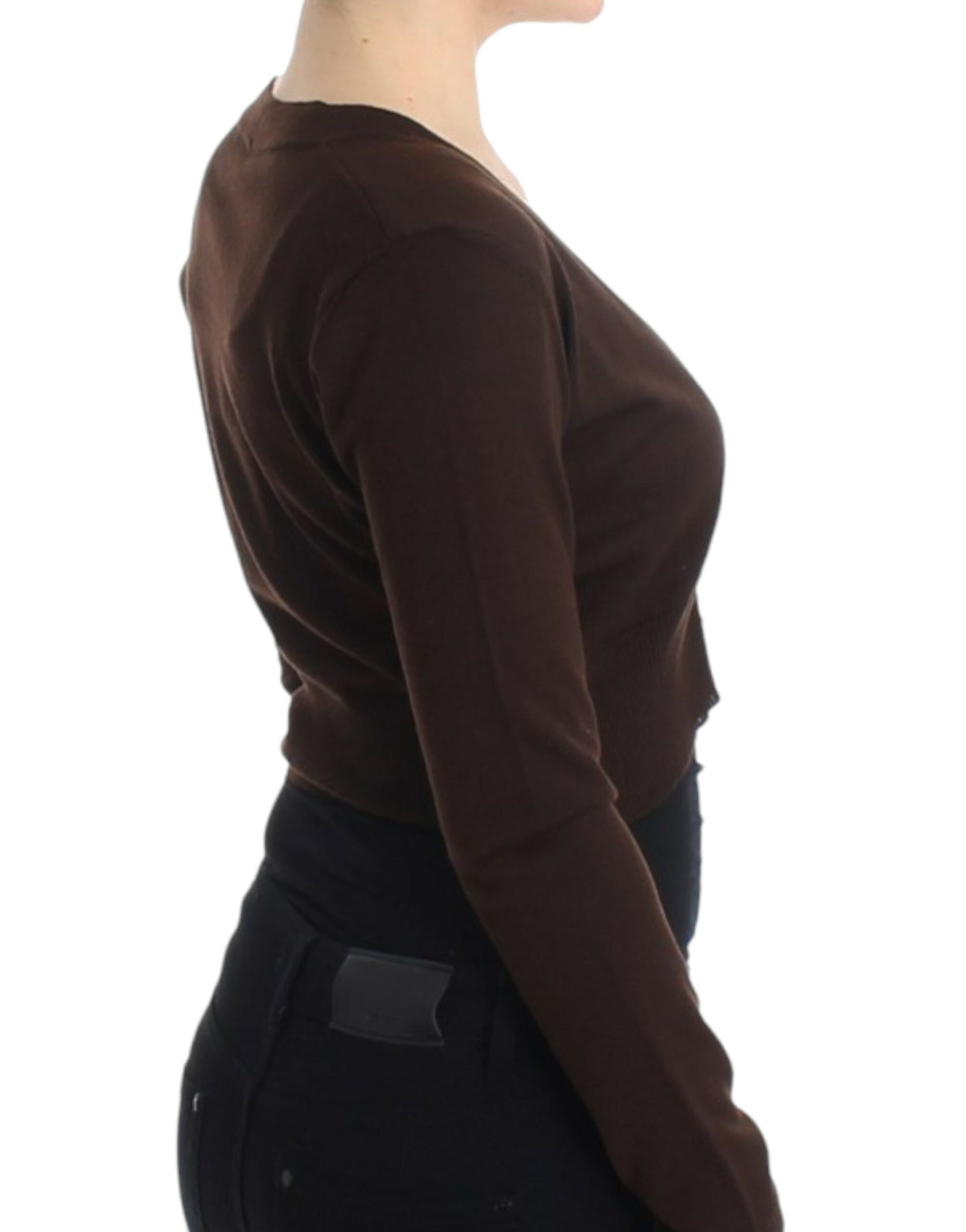 Woman wearing brown sweater and black pants