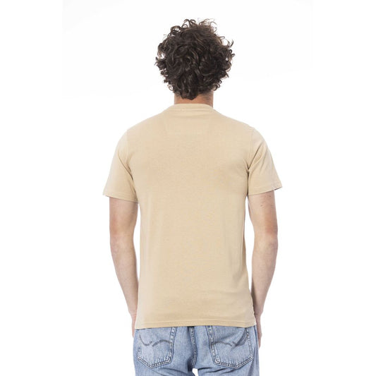 Man wearing tan t-shirt and blue jeans