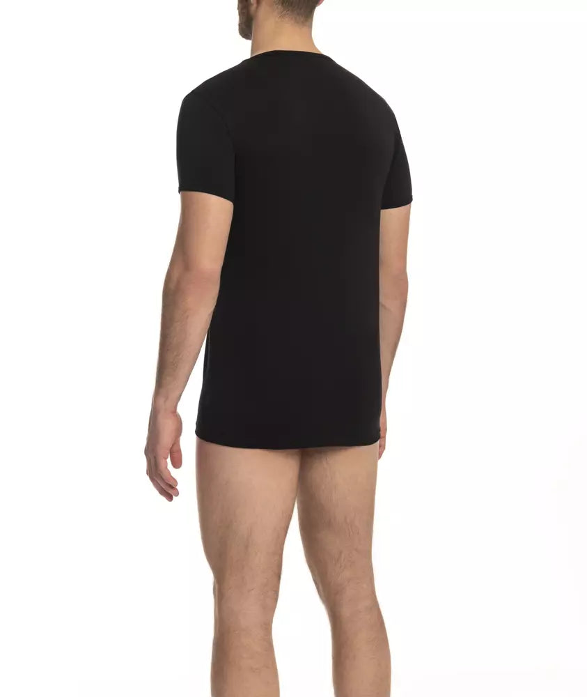 Man wearing black t-shirt and boxer shorts