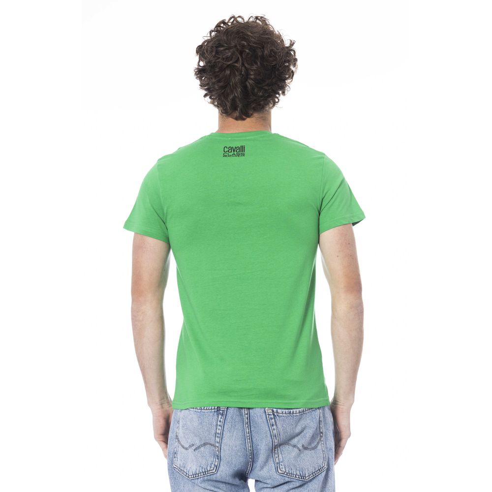 Man wearing green t-shirt and blue jeans