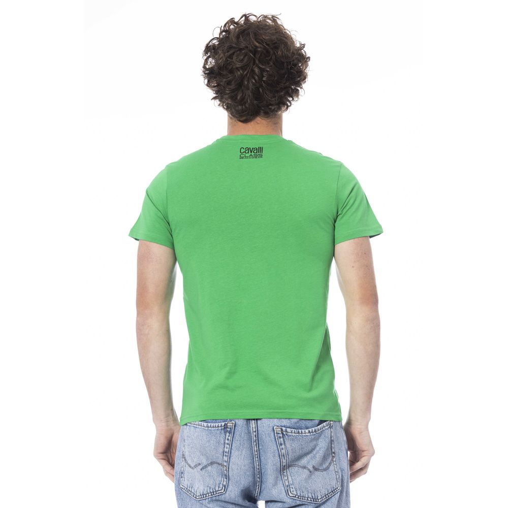 Man wearing green t-shirt and blue jeans
