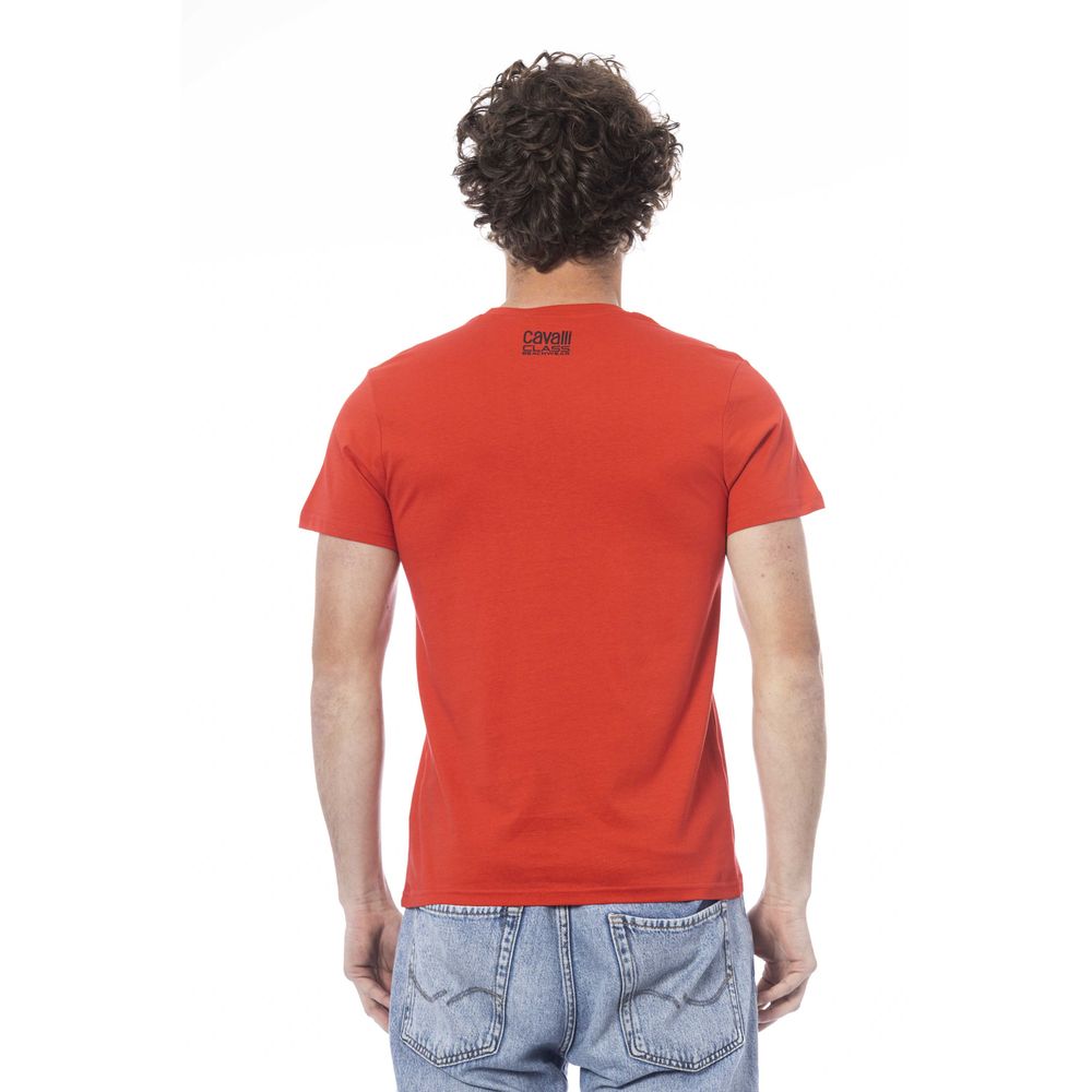 Man wearing red t-shirt and blue jeans
